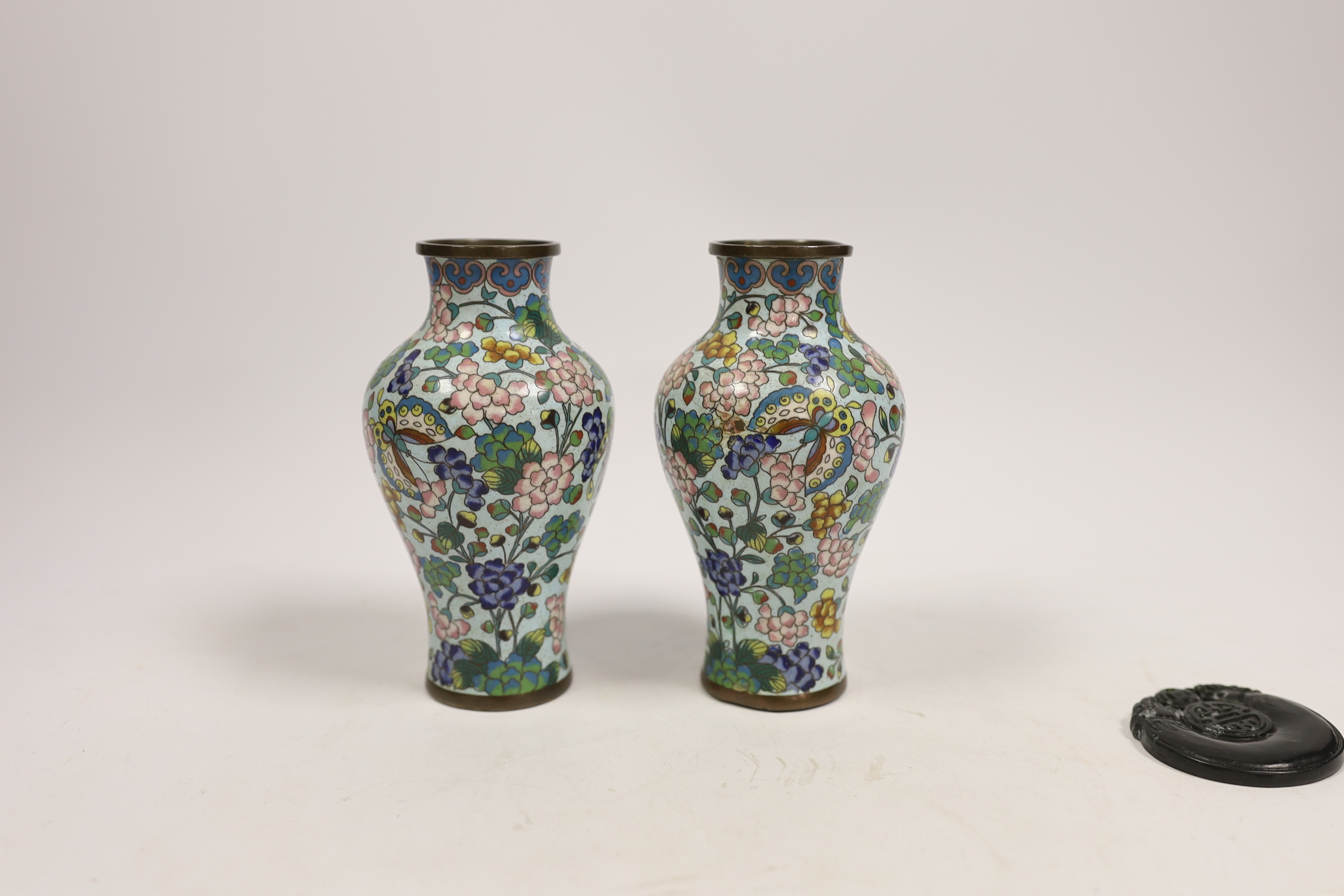 A pair of Chinese cloisonné enamel vases, 12.5cm, a lacquered box with mother of pearl inlay, a carved black stone disc, 5cm diameter, and a miniature ceramic pot (5)